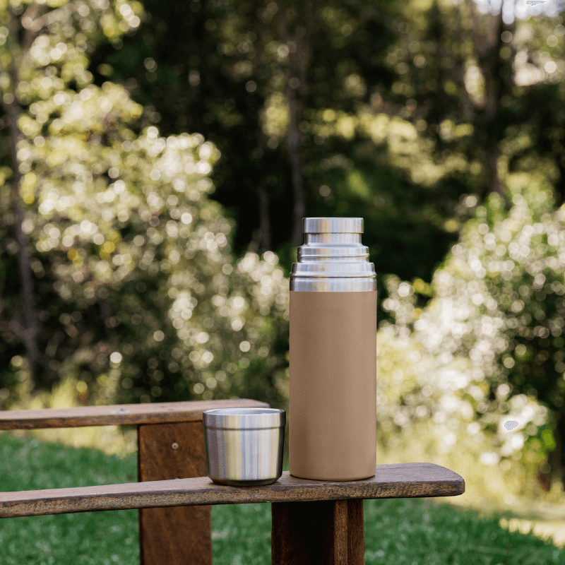 Seed & Sprout 900ml Insulated Stainless Steel Drink Flask in Praline Outdoor Nature Setting.