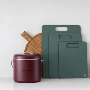 Seed & Sprout eco-friendly kitchen bundle including a mulberry compost bin and a set of green sustainable cutting boards.