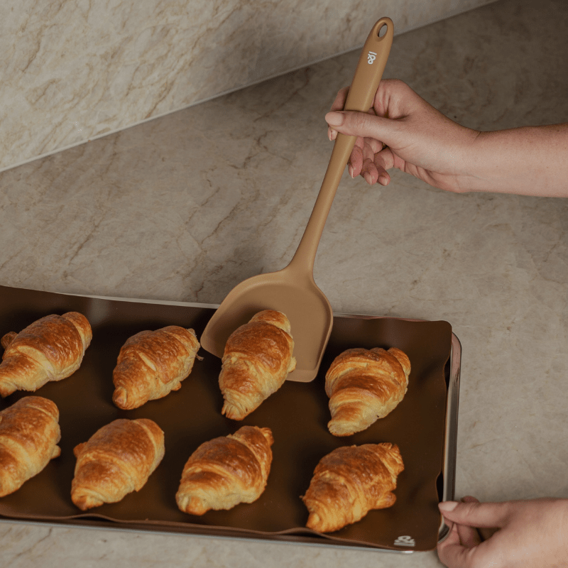 Seed & Sprout Silicone Spatula and Baking Mat in Action on Kitchen Countertop.