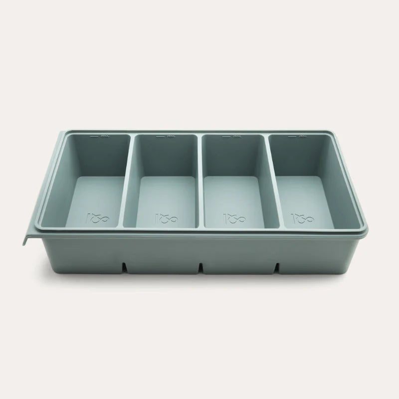 An open Seed & Sprout 4 Portion Silicone Freezer Tray in eucalyptus featuring four empty internal compartments.