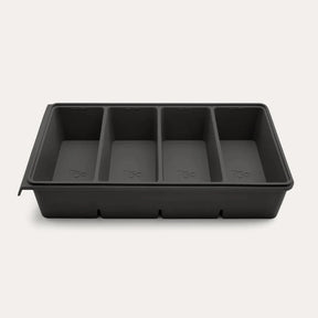 An open Seed & Sprout 4 Portion Silicone Freezer Tray showing four empty internal compartments.