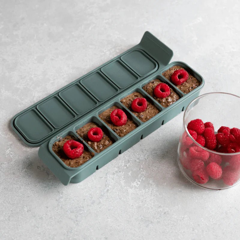 Seed & Sprout 6 Portion Silicone Freezer Tray (50ml) filled with meal prepped portions and fresh raspberries.