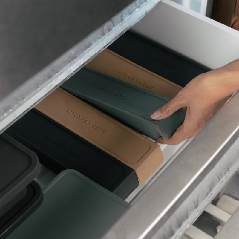 Seed & Sprout silicone freezer trays organized inside a kitchen freezer.