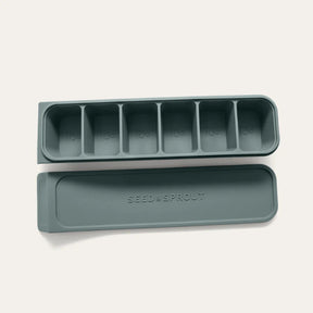 Seed & Sprout 6 Portion Eucalyptus Silicone Freezer Tray with embossed branding and lid.