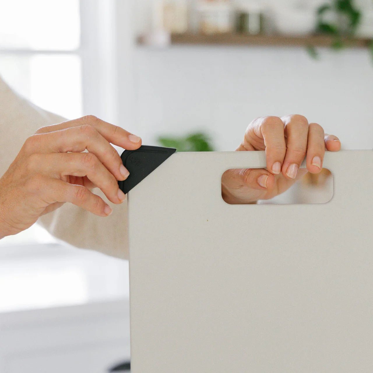 Seed & Sprout Anti-Slip Chopping Board Corners being attached to a cutting board.
