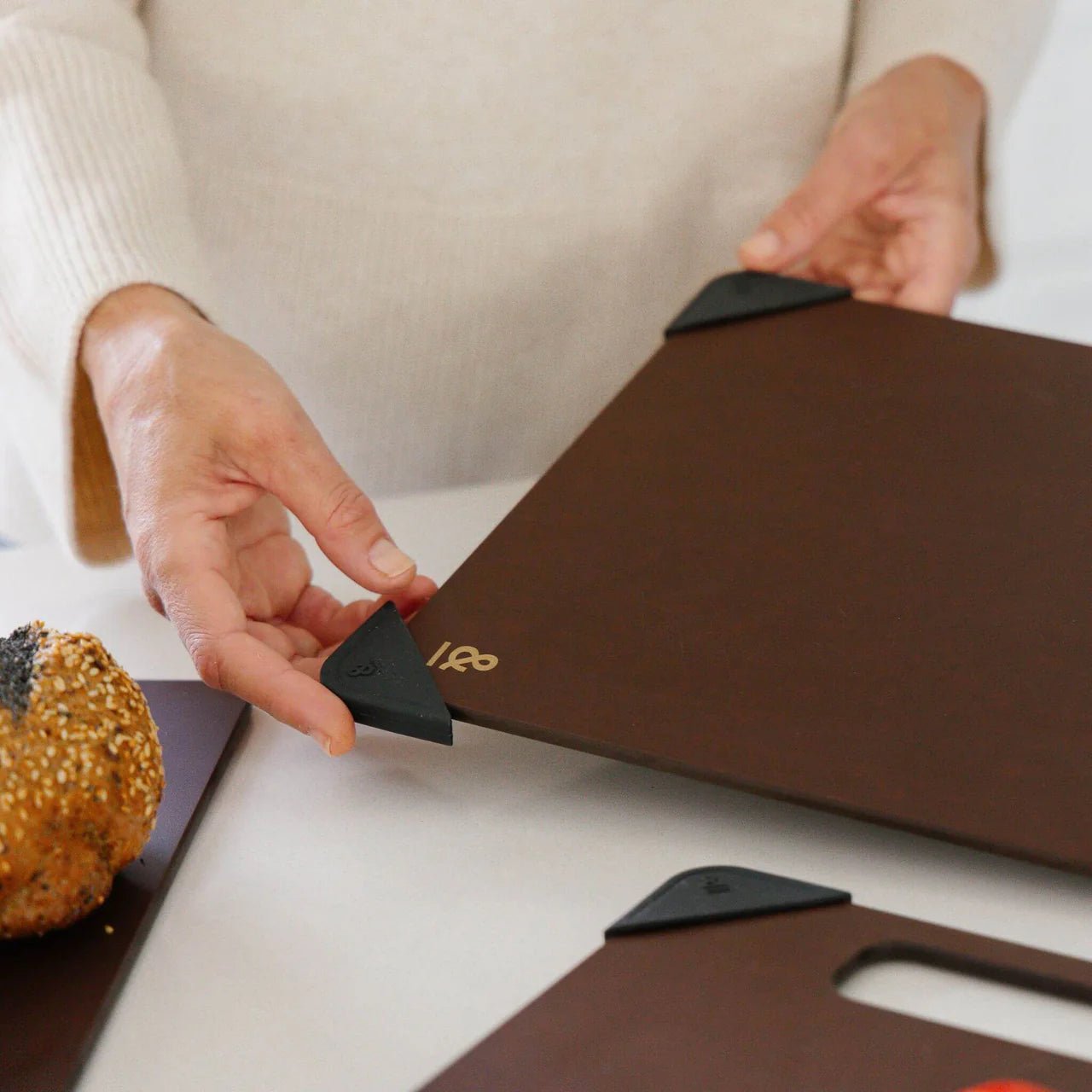 Seed & Sprout Anti-Slip Chopping Board Corners attached to a nutmeg cutting board.