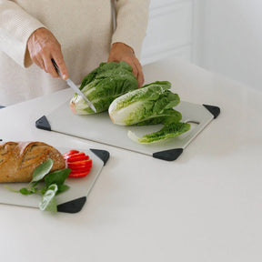 Seed & Sprout Anti-Slip Chopping Board Corners in use on a cutting board during food preparation.