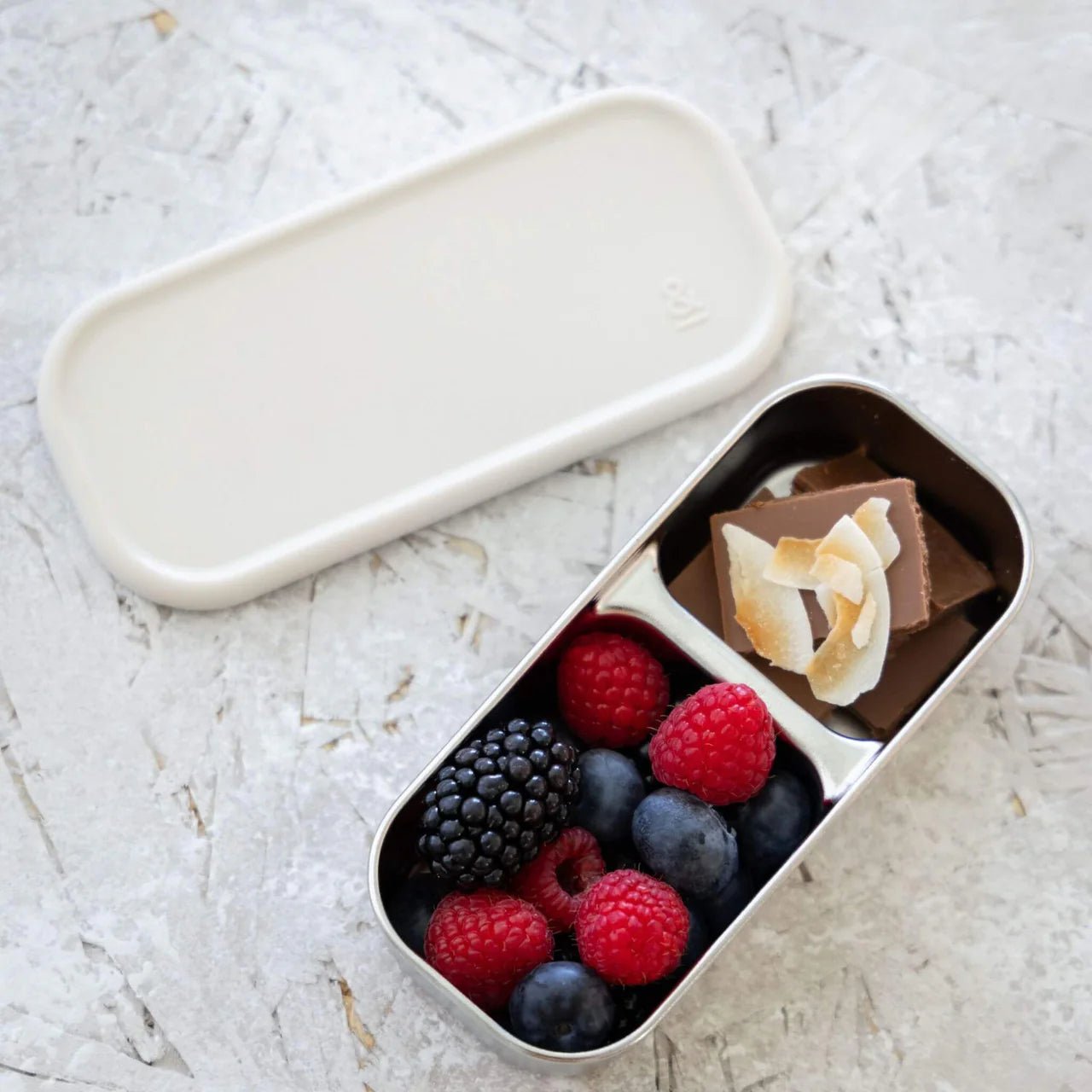 Seed & Sprout CrunchBox™ Split Snackpot filled with berries and coconut chocolate.