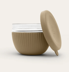 Seed & Sprout Praline 1000ml glass lunch bowl featuring a ribbed protective silicone base and a matching leakproof lid displayed.