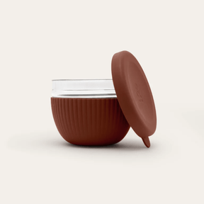 Seed & Sprout Cocoa 1000ml glass lunch bowl featuring a ribbed protective silicone base and a matching leakproof lid displayed.