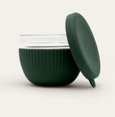 Seed & Sprout 1000ml glass lunch bowl in Moss featuring a ribbed protective silicone base and a matching leakproof lid displayed.