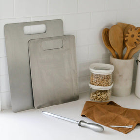 Seed & Sprout titanium cutting boards and knife sharpener styled in a kitchen setting.