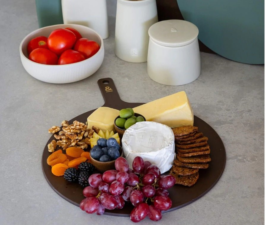 Seed & Sprout Limited Edition Round Wood Fibre Chopping Board styled as a charcuterie and cheese platter.