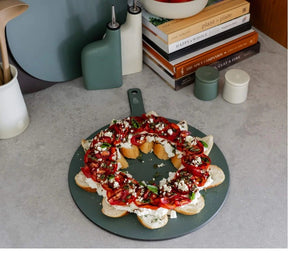 Seed & Sprout Limited Edition Round Wood Fibre Chopping Board styled as a festive appetizer wreath.