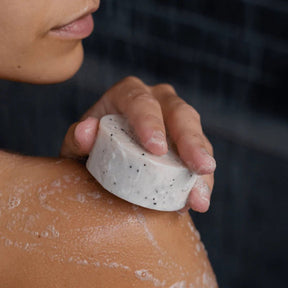 Seed & Sprout Natural Body Wash Bar in use during a shower.