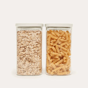 Seed & Sprout Newrybar Square Glass Pantry Jars 1500ml 2-pack filled with oats and pasta.