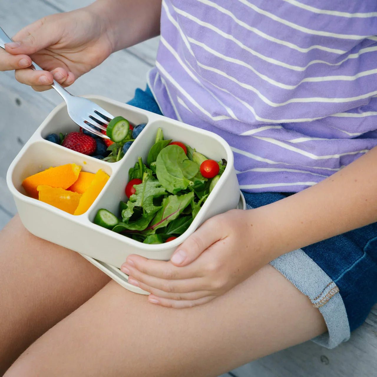 Seed & Sprout Silicone Bento Box packed with a healthy lunch outdoors.