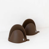 Seed & Sprout Clove Silicone Oven Mitt Set in Marble Countertop Setting.