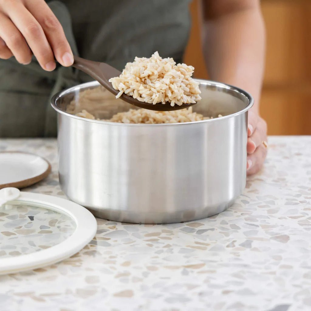 Seed & Sprout Silicone Rice Spoon in Clove use in serving brown rice.