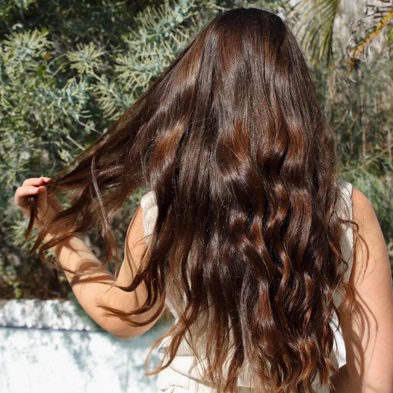 Seed & Sprout hair care results showcasing healthy, radiant, wavy brown hair.