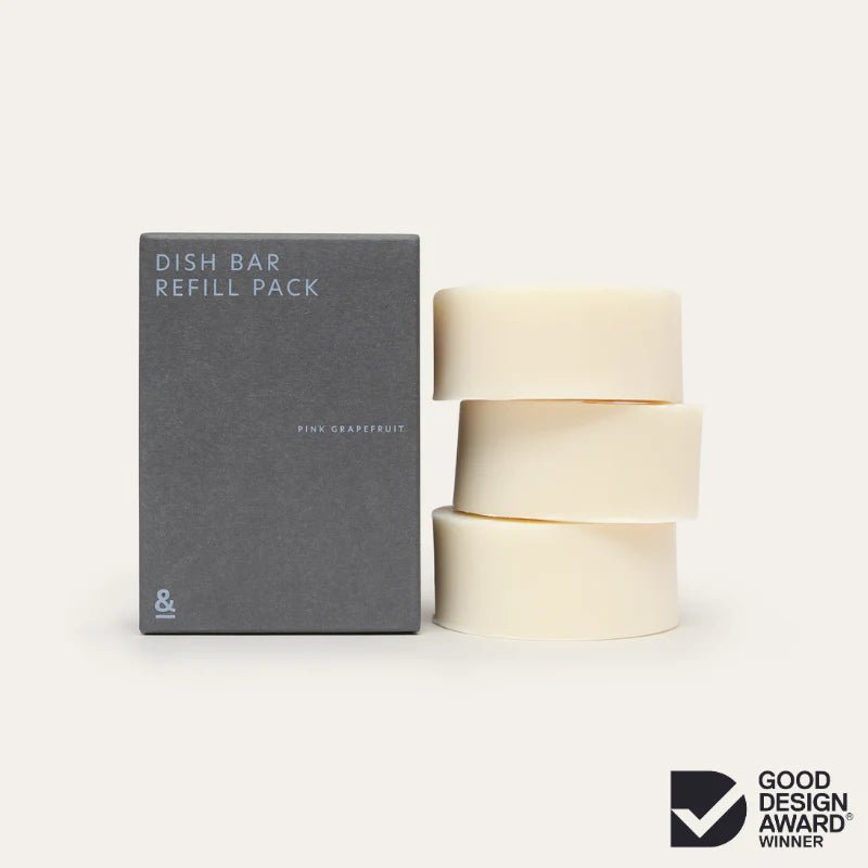Seed & Sprout Dish Bar Refill Pack in dark grey cardboard box next to three stacked off-white dish soap bars.