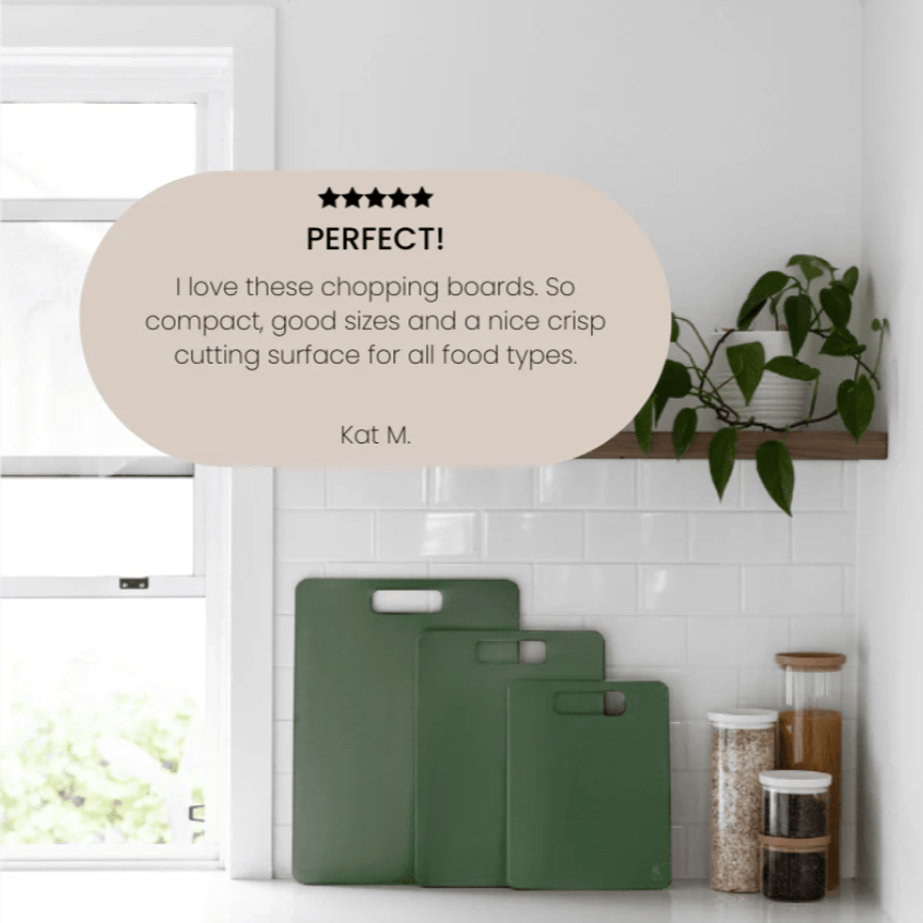 Seed & Sprout set of three Eucalyptus wood fibre chopping boards displayed in graduated sizes against a white tiled kitchen backsplash, featuring a superimposed 5-star customer review quote.
