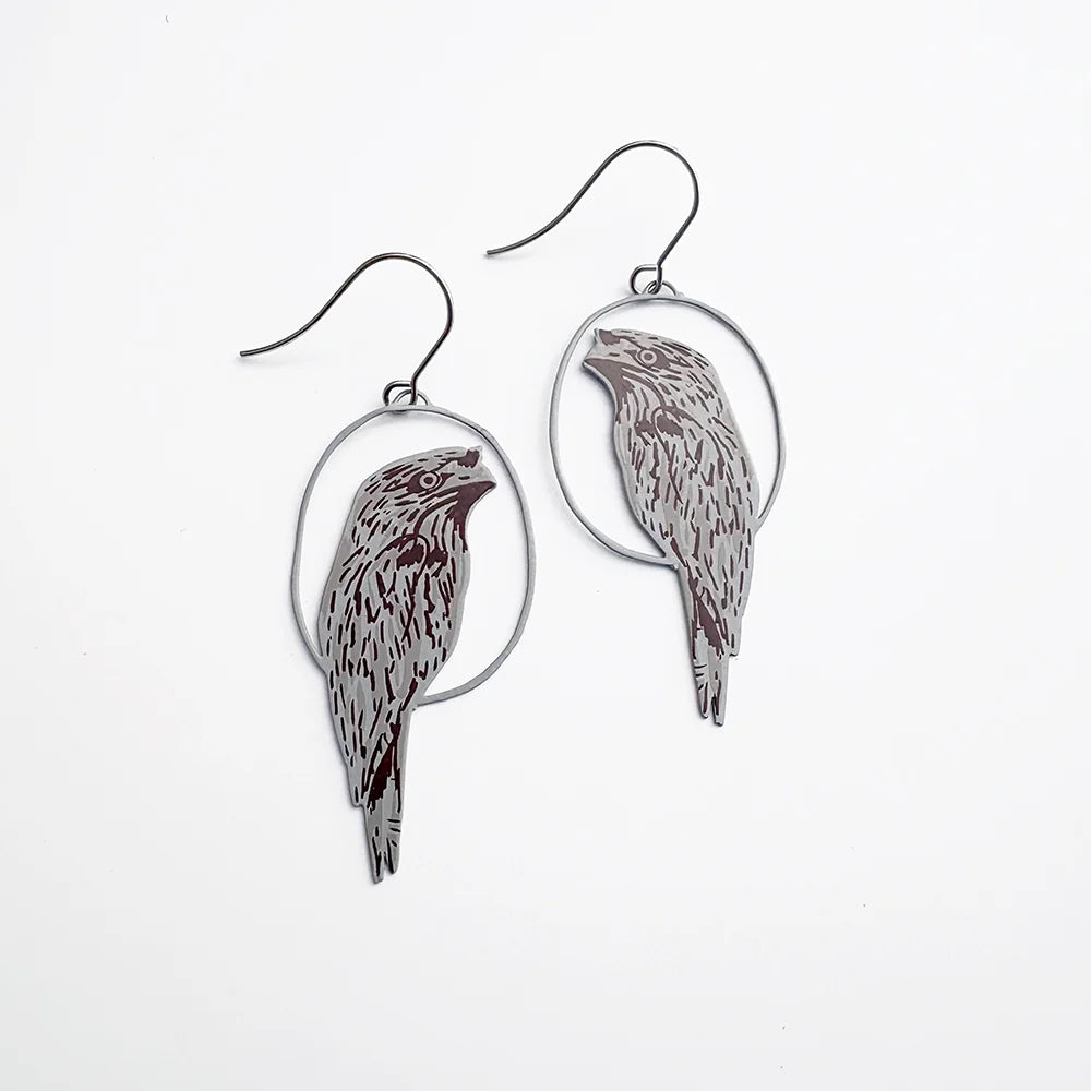 DENZ Tawny Frogmouth earrings on a white background