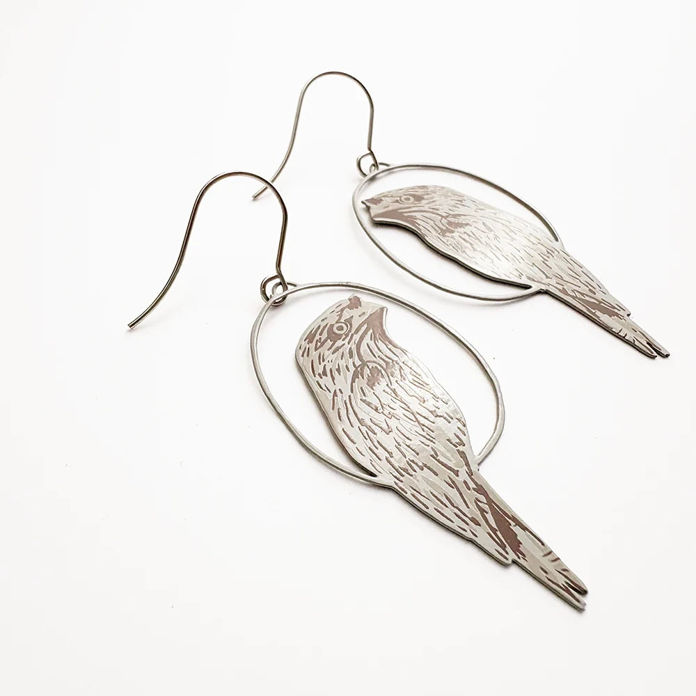 DENZ Tawny Frogmouth earrings on a white background