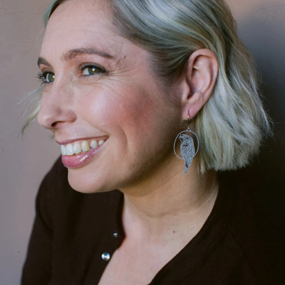 Woman with short blonde hair wearing a DENZ Tawny Frogmouth