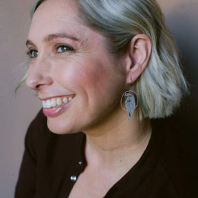 Woman with short blonde hair wearing a DENZ Tawny Frogmouth