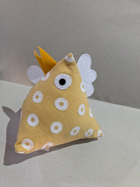 Thurlby Herb Farm Kitchen Pantry Poultry Coloured made from yellow dotted fabric with a white and yellow ring pattern, complete with a yellow beak, white crest details, and an embroidered eye.