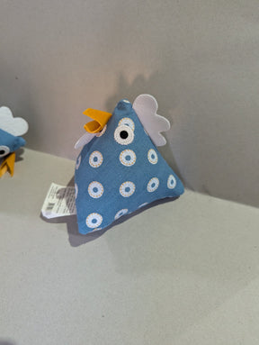Thurlby Herb Farm Kitchen Pantry Poultry Coloured made from blue dotted fabric with a white and yellow ring pattern, complete with a yellow beak, white crest details, and an embroidered eye.