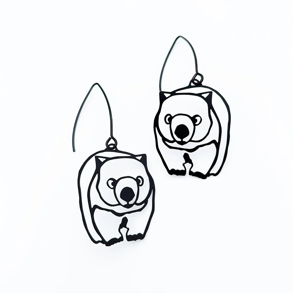 A pair of DENZ Wombat dangle earrings on a solid white background.