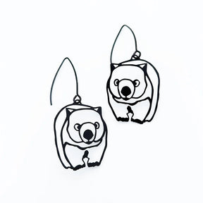 A pair of DENZ Wombat dangle earrings on a solid white background.