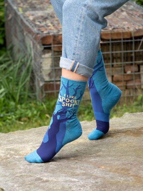 Blue Q I Like Spooky Shit Womens Crew Socks On Model Lifestyle Outdoor Photo.