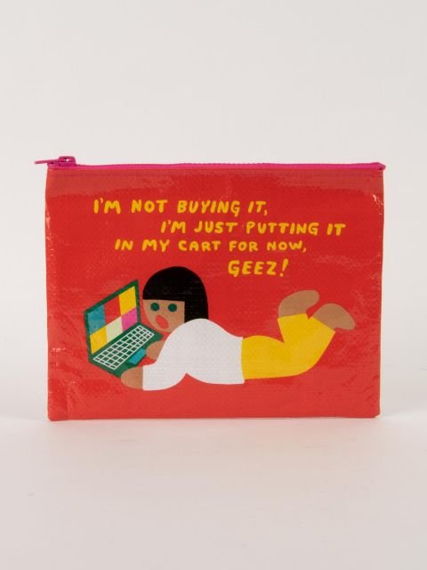 A red Blue Q zipper pouch illustrating a person lying down with a laptop below yellow text reading "I'M NOT BUYING IT, I'M JUST PUTTING IT IN MY CART FOR NOW, GEEZ!"