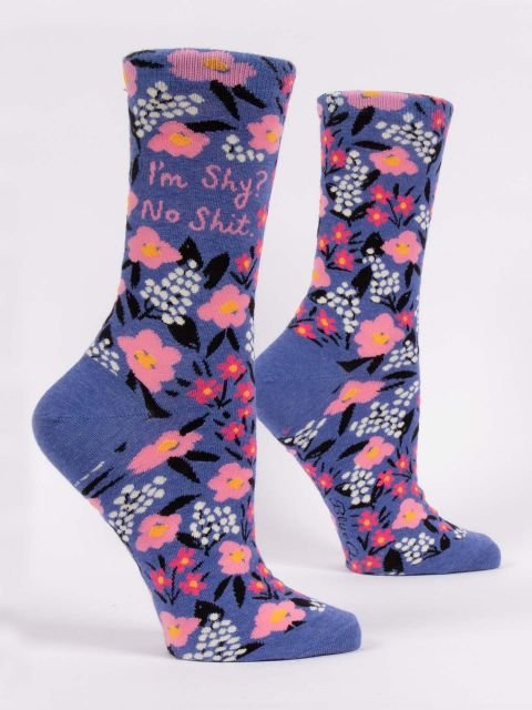 Pair of Blue Q women's periwinkle blue crew socks with a pink floral pattern reading "I'm Shy? No Shit."