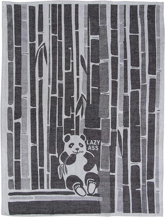 Full view of an unfolded black and off-white woven Blue Q tea towel showing a panda eating bamboo in a dense bamboo forest with the text "LAZY ASS".