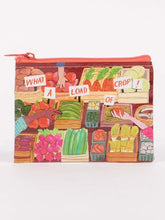 A Blue Q zippered coin purse featuring a colorful farmers market produce stall illustration with cut-out style text reading "WHAT A LOAD OF CROP!"