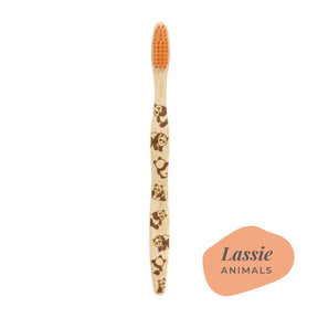 Brush It On Lassie adult bamboo toothbrush featuring panda handle engravings and orange bristles