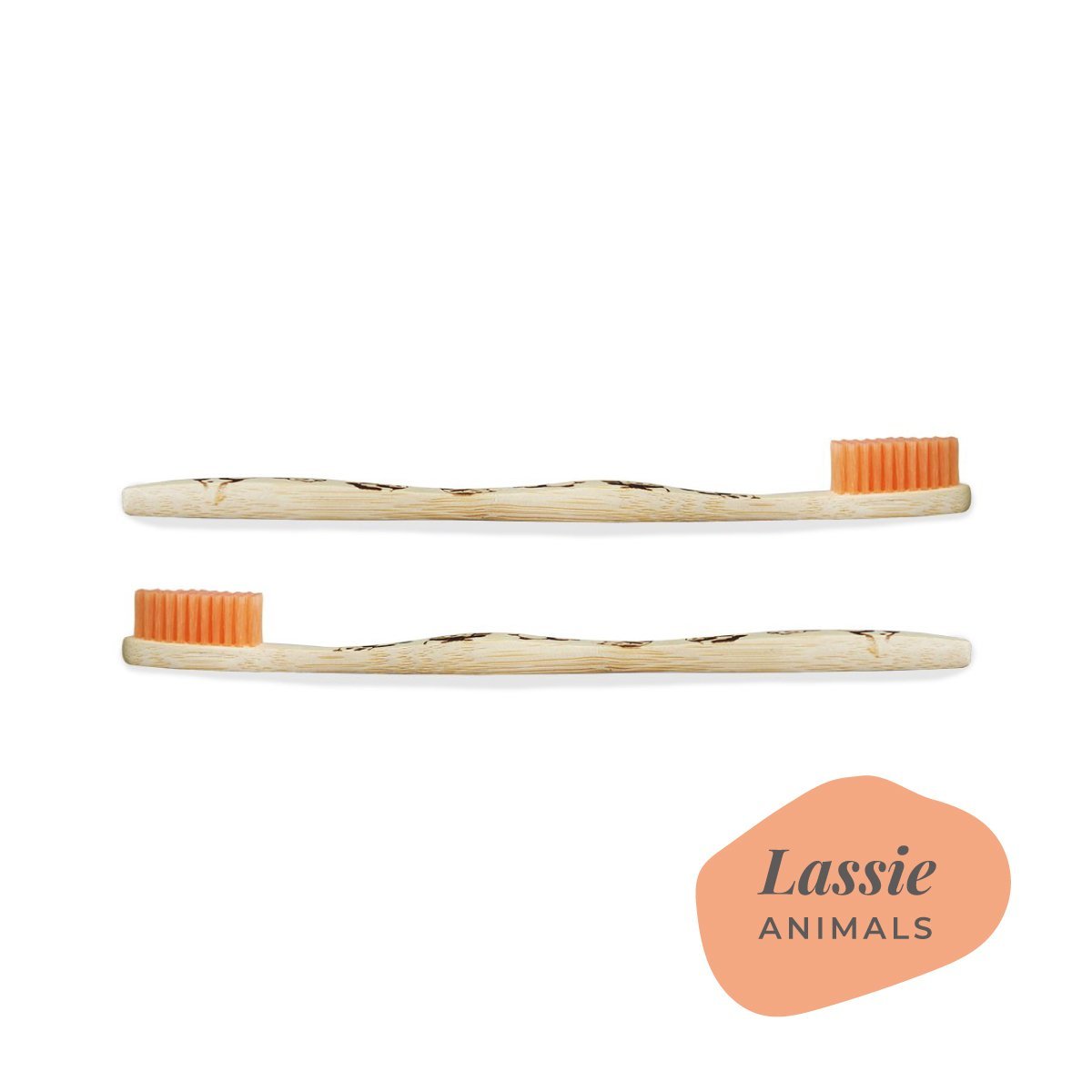 Brush It On Lassie adult bamboo toothbrushes with panda handle engravings and orange bristles, shown horizontally
