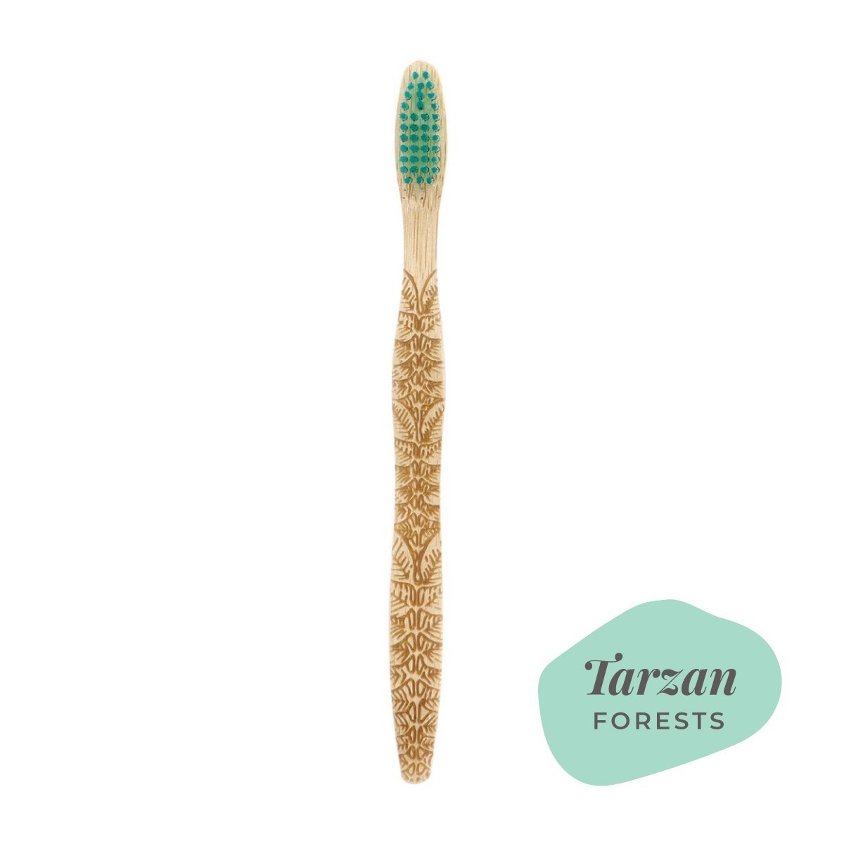 Brush It On Tarzan bamboo toothbrush featuring intricate forest leaf handle engravings and teal bristles
