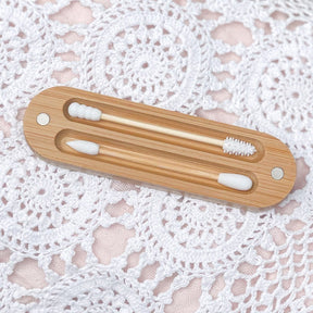 Brush It On reusable silicone buds with bamboo handles resting inside a bamboo magnetic case top-down view