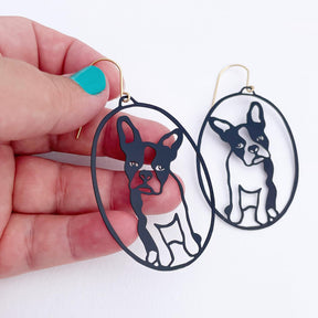 DENZ Frenchies in Black earrings, held by hand