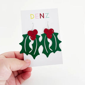DENZ Holly in painted steel dangles, held by hand