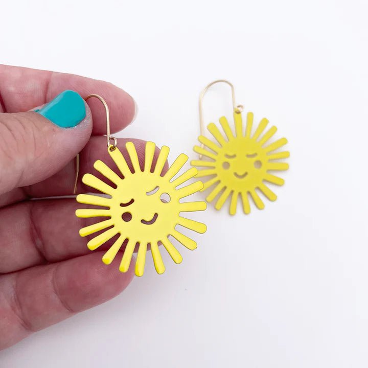 DENZ Mini Yellow Suns, held by hand