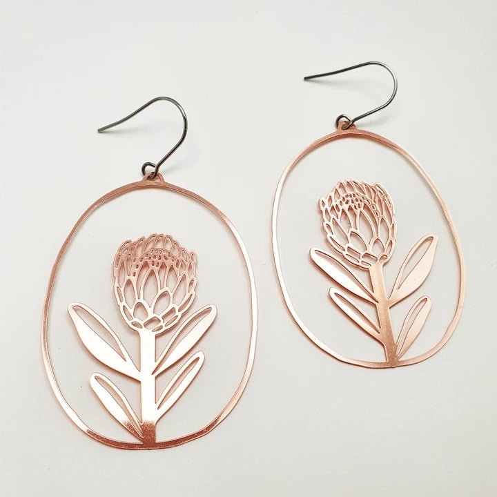 DENZ Proteas in rose gold earrings