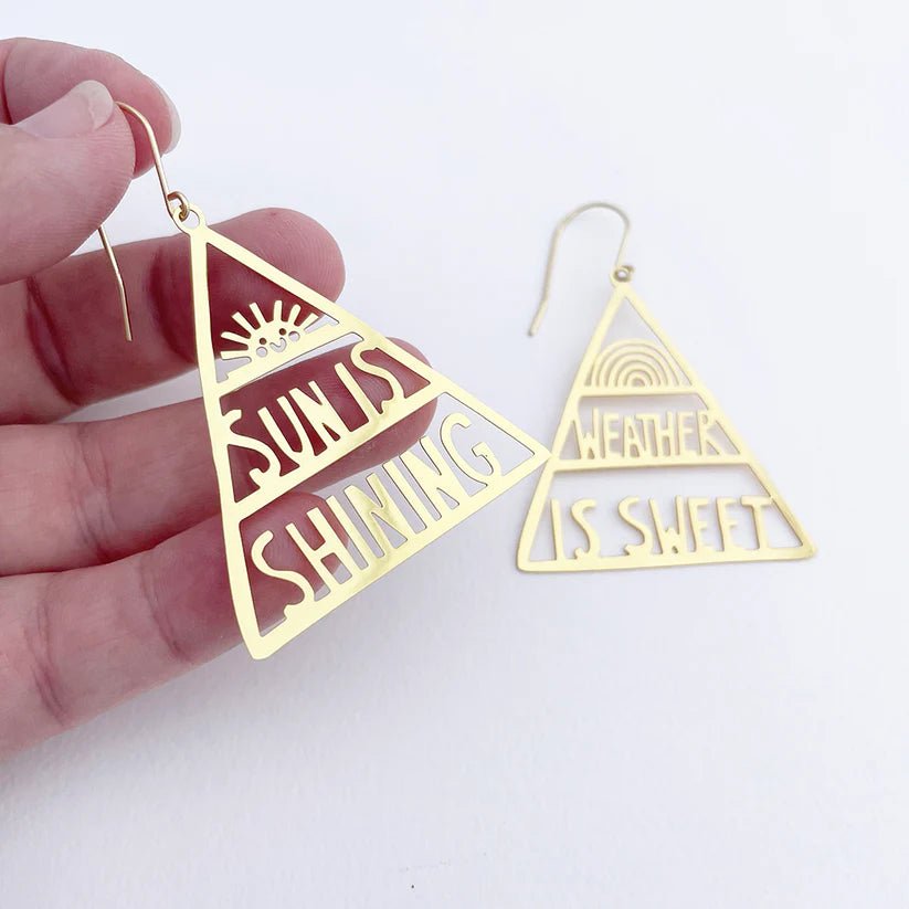 DENZ Sun is Shining, Weather is Sweet in Gold earrings, held by hand