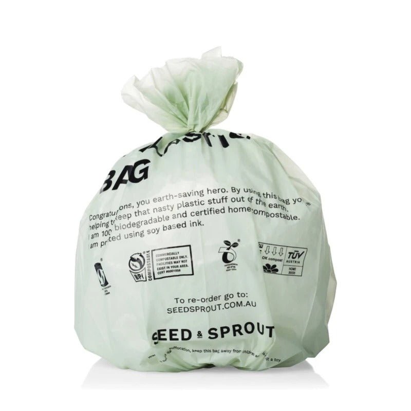 Seed & Sprout 8L sage green compostable bin liner filled and tied at the top