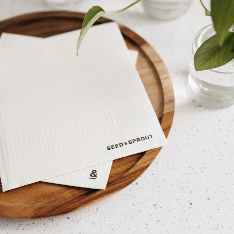 Seed & Sprout cellulose sponge cloth set of 2 in cloud white featuring clean black logo branding.